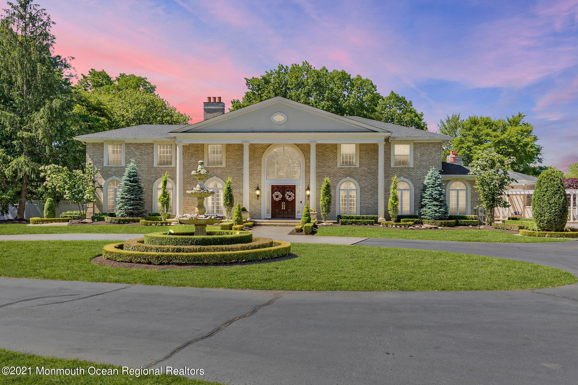 16 A Buttonwood Lane Rumson, NJ 07760 - Photo 1 of 80 a front view of a house with a garden