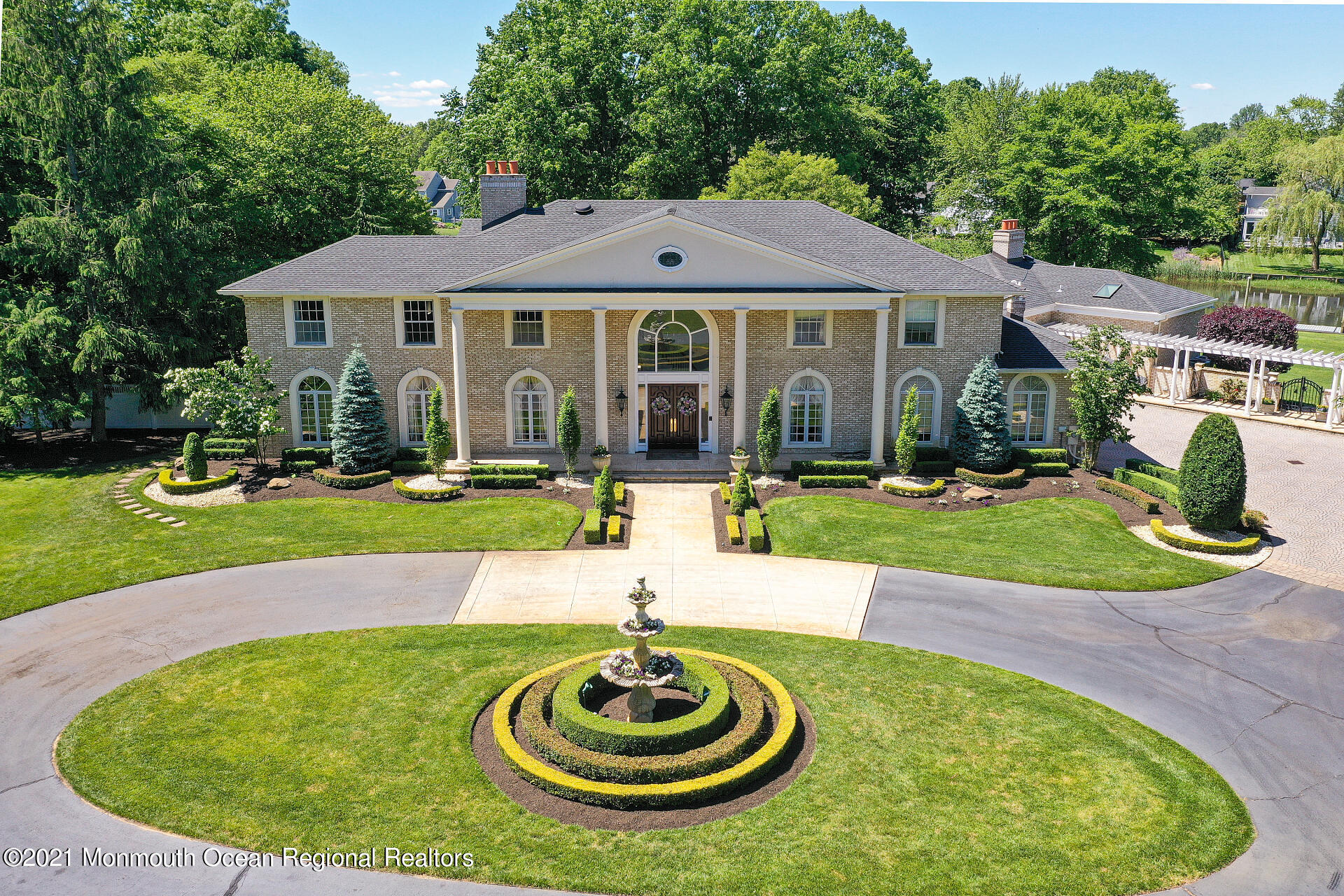 16 A Buttonwood Lane Rumson, NJ 07760 - Photo 58 of 80 a view of a house with swimming pool and a yard