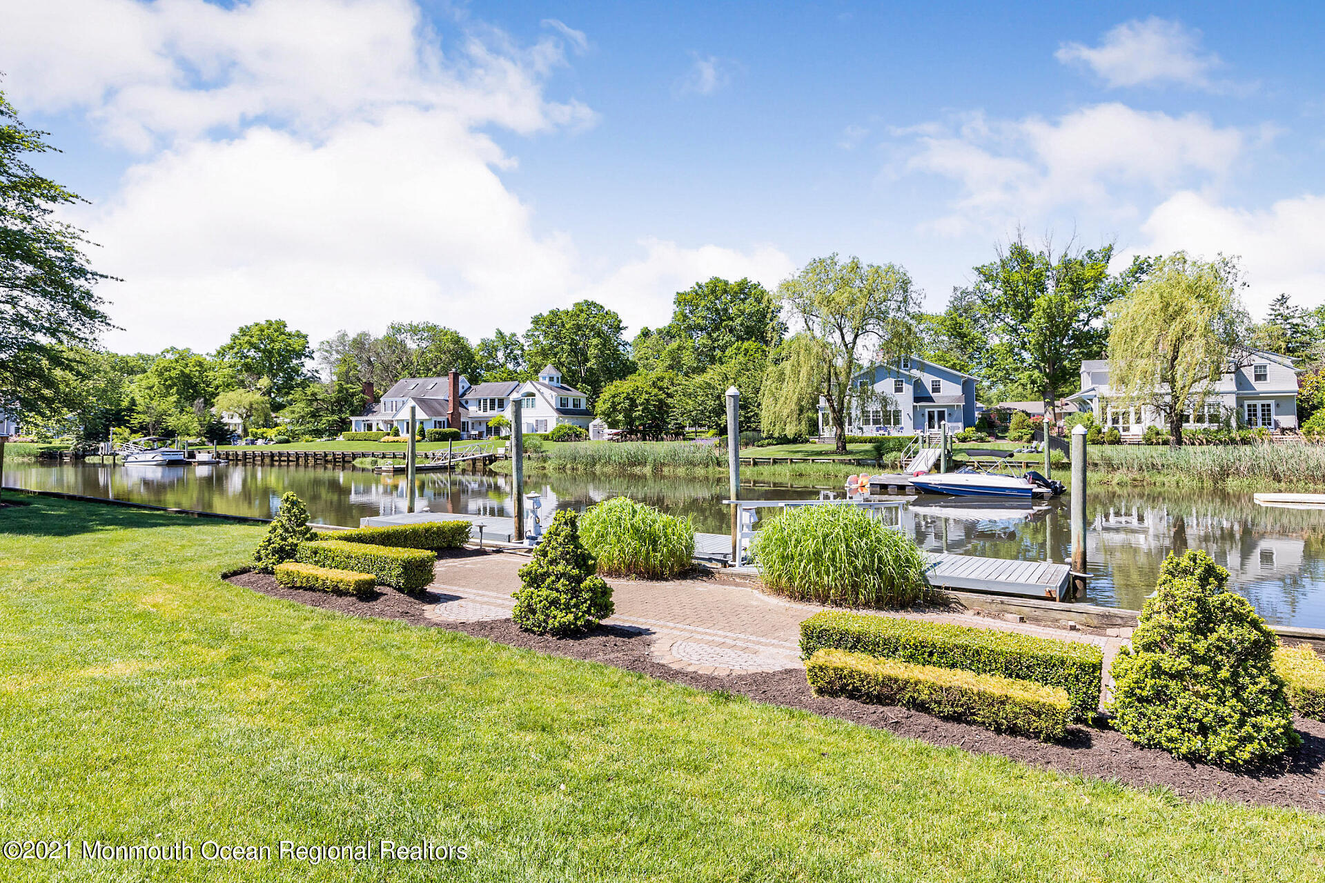 16 A Buttonwood Lane Rumson, NJ 07760 - Photo 65 of 80 a garden view with a seating space and a lake view