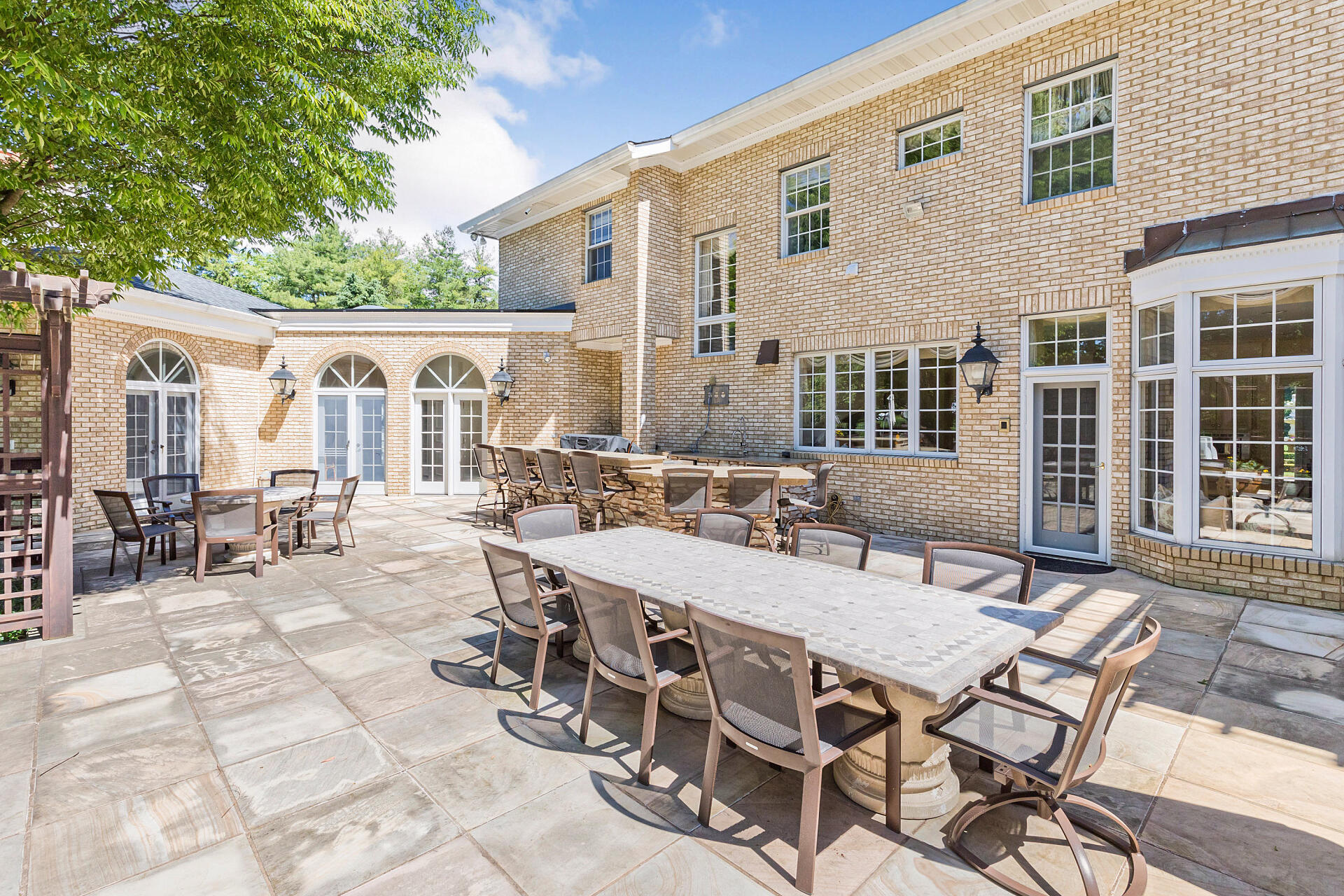 16 A Buttonwood Lane Rumson, NJ 07760 - Photo 73 of 80 a view of a patio with table and chairs with wooden floor and fence