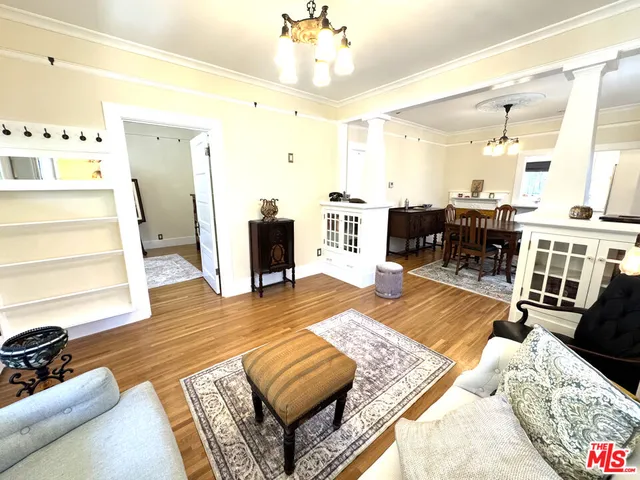 a kitchen with a sink window and cabinets