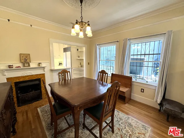 a living room with a fireplace and a table