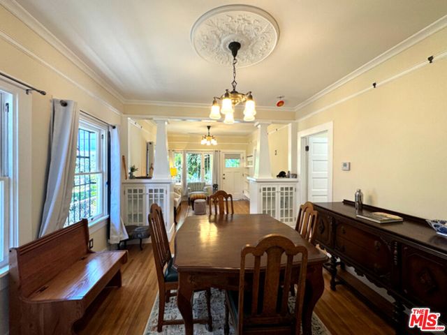a view of a dining room with furniture and wooden floor
