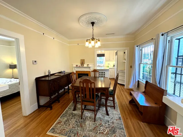 a bathroom with a toilet a sink and a mirror