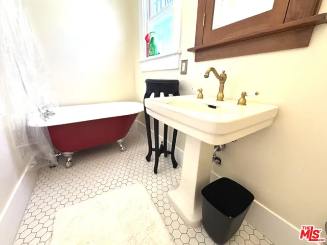 a view of backyard with tub and trees