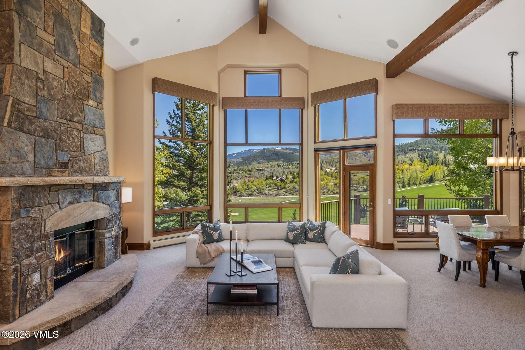 167 Saddle Ridge Edwards, CO 81632 - Photo 2 of 41 a living room with furniture fireplace and floor to ceiling windows