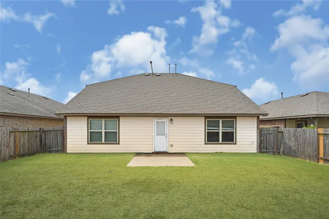 a house view with a backyard space