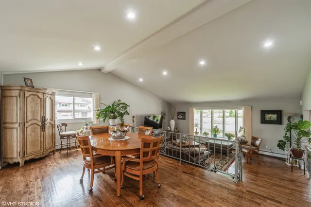 a view of a dining room with furniture window and wooden floor