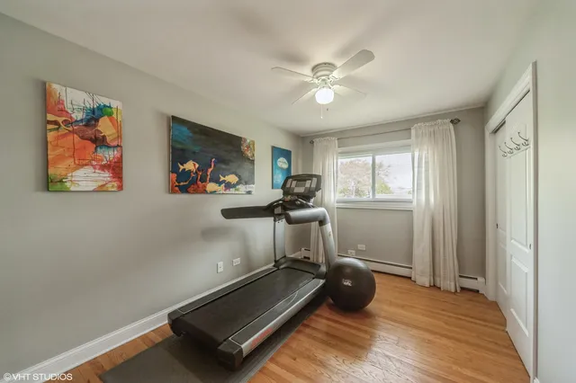 a room with gym equipment and a window