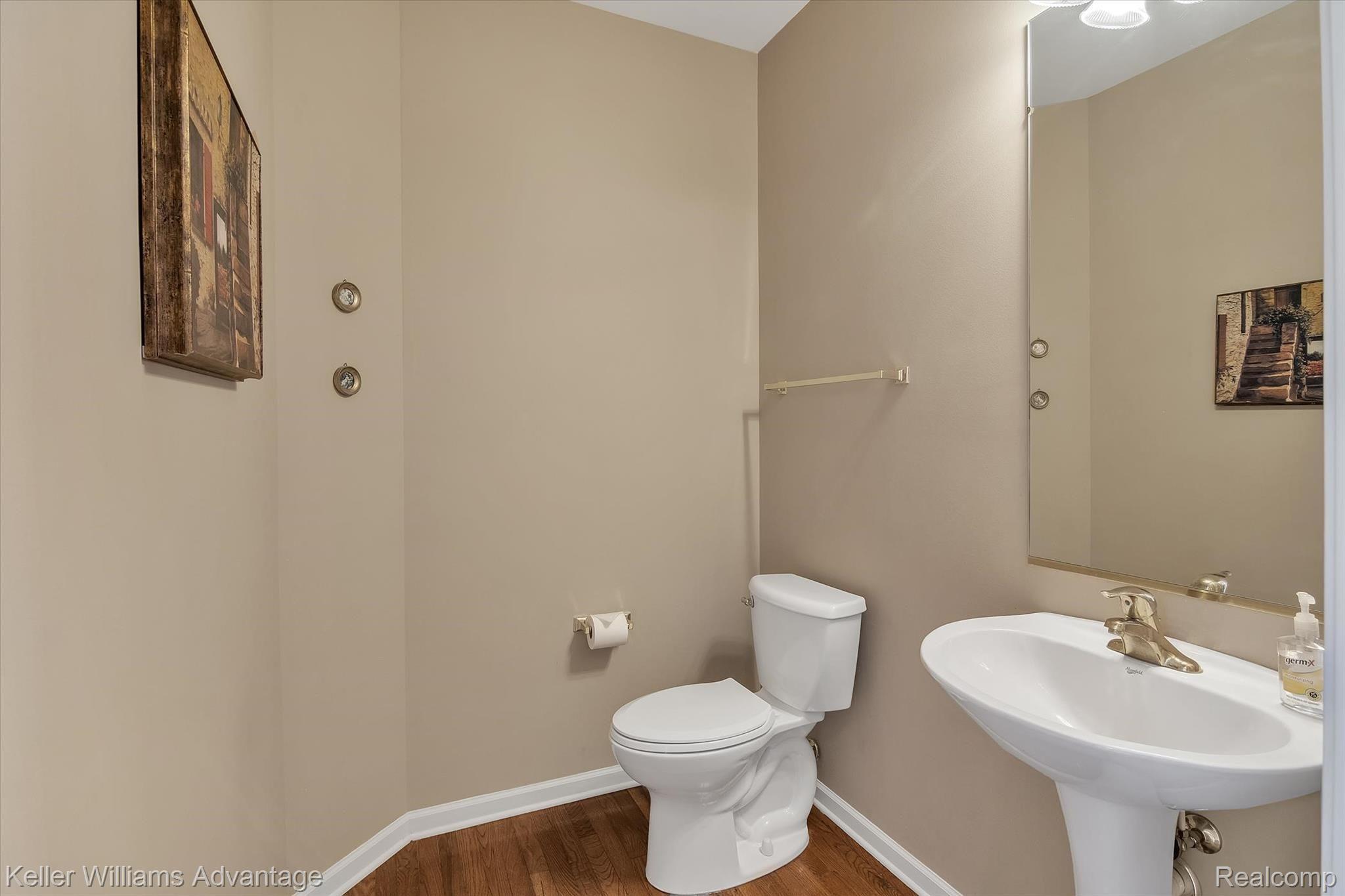9042 Ridgefield Drive Brighton, MI 48114 - Photo 44 of 61 First floor powder room bath right off the main foyer