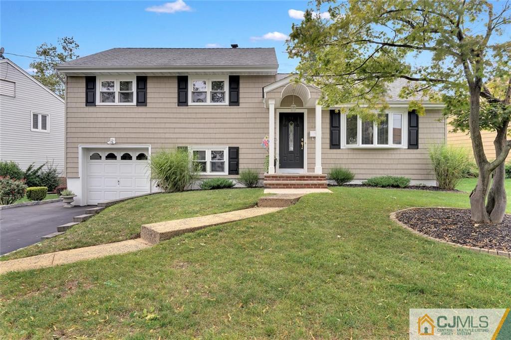 642 Inwood Road Linden, NJ 07036 - Photo 1 of 25 a front view of a house with a yard