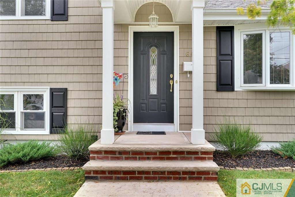 642 Inwood Road Linden, NJ 07036 - Photo 2 of 25 a front view of a house with a garden