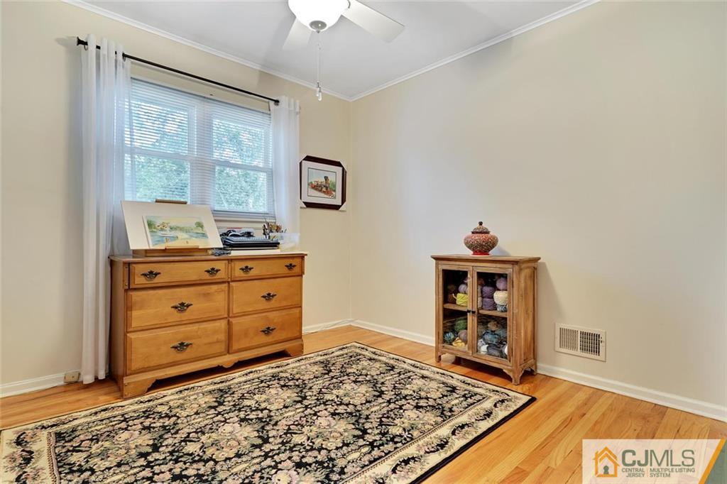 642 Inwood Road Linden, NJ 07036 - Photo 16 of 25 a living room with furniture and a window