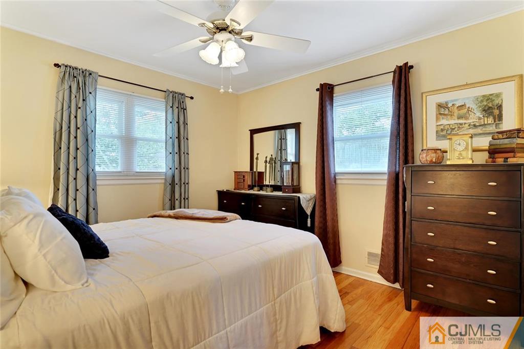 642 Inwood Road Linden, NJ 07036 - Photo 20 of 25 a bedroom with a bed and a dresser