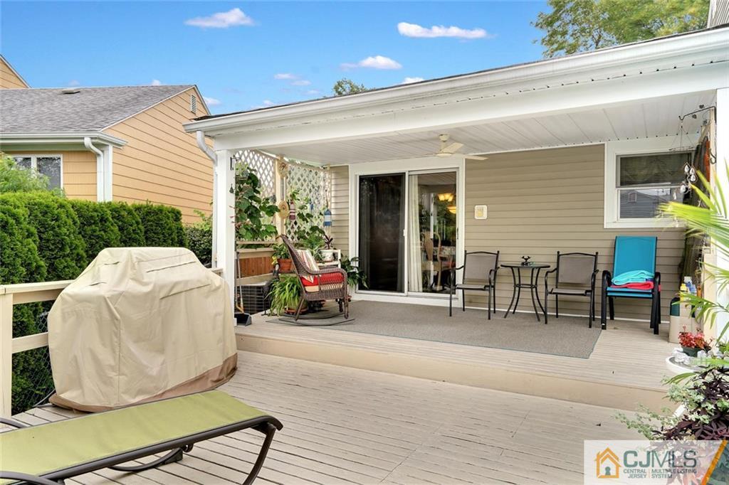642 Inwood Road Linden, NJ 07036 - Photo 25 of 25 a view of a patio with table and chairs and potted plants