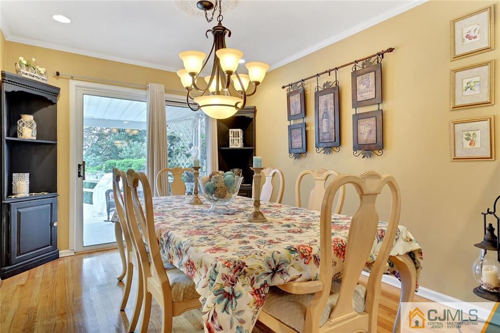 642 Inwood Road Linden, NJ 07036 - Photo 8 of 25 a view of a dining room with furniture chandelier and wooden floor