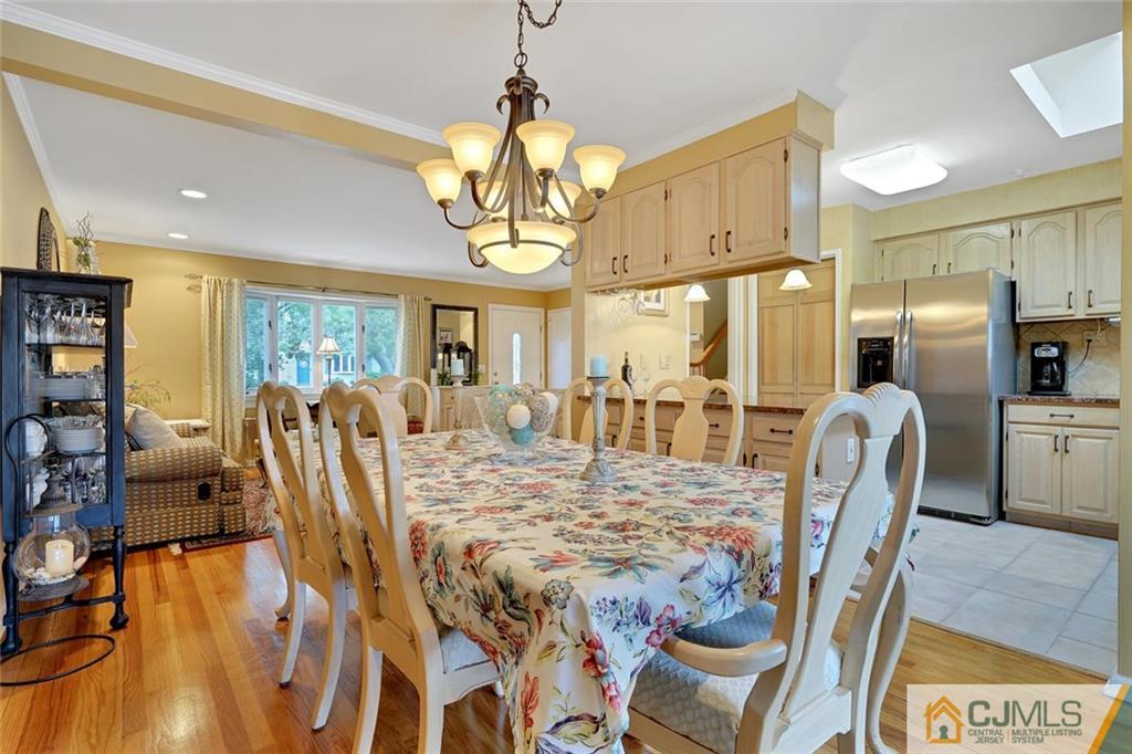 642 Inwood Road Linden, NJ 07036 - Photo 9 of 25 a view of a dining room with furniture and a chandelier