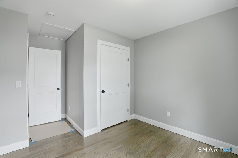 796 Maple Hill Road Naugatuck, CT 06770 - Photo 18 of 35 a view of an empty room with wooden floor