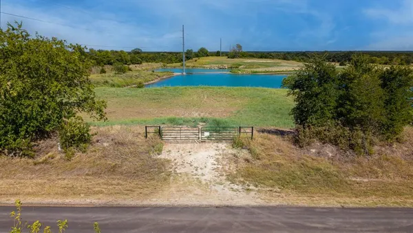 a view of a lake with a yard