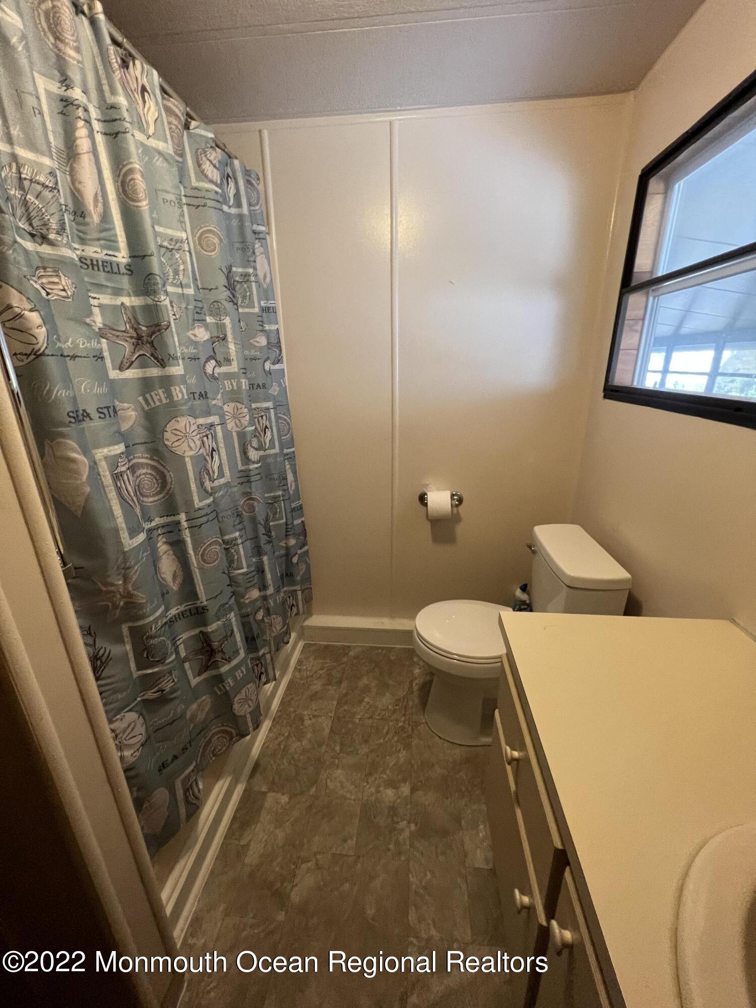 705 Aviary Way Toms River, NJ 08755 - Photo 13 of 14 a bathroom with a sink and a shower