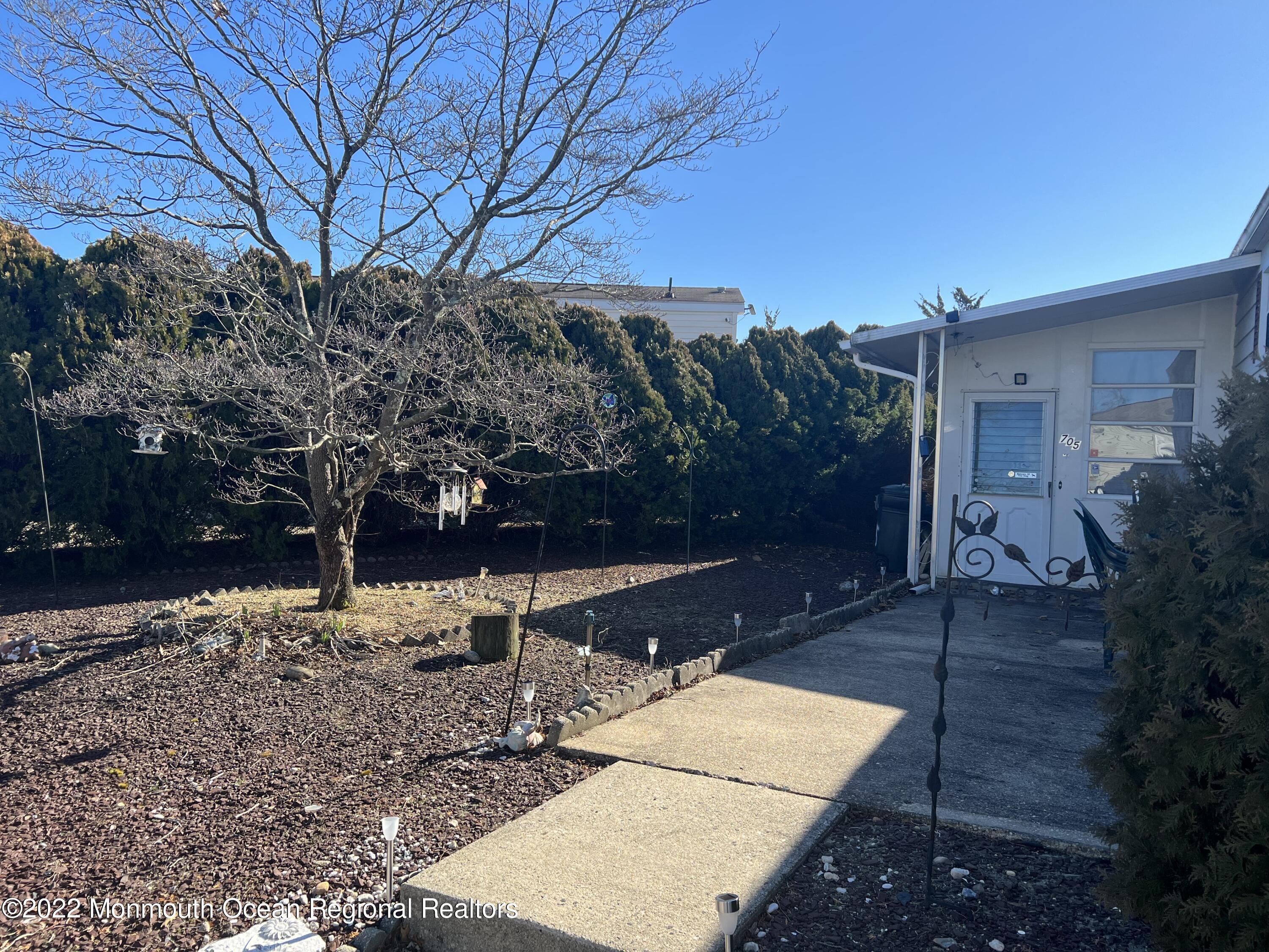 705 Aviary Way Toms River, NJ 08755 - Photo 2 of 14 a backyard of a house with lots of green space