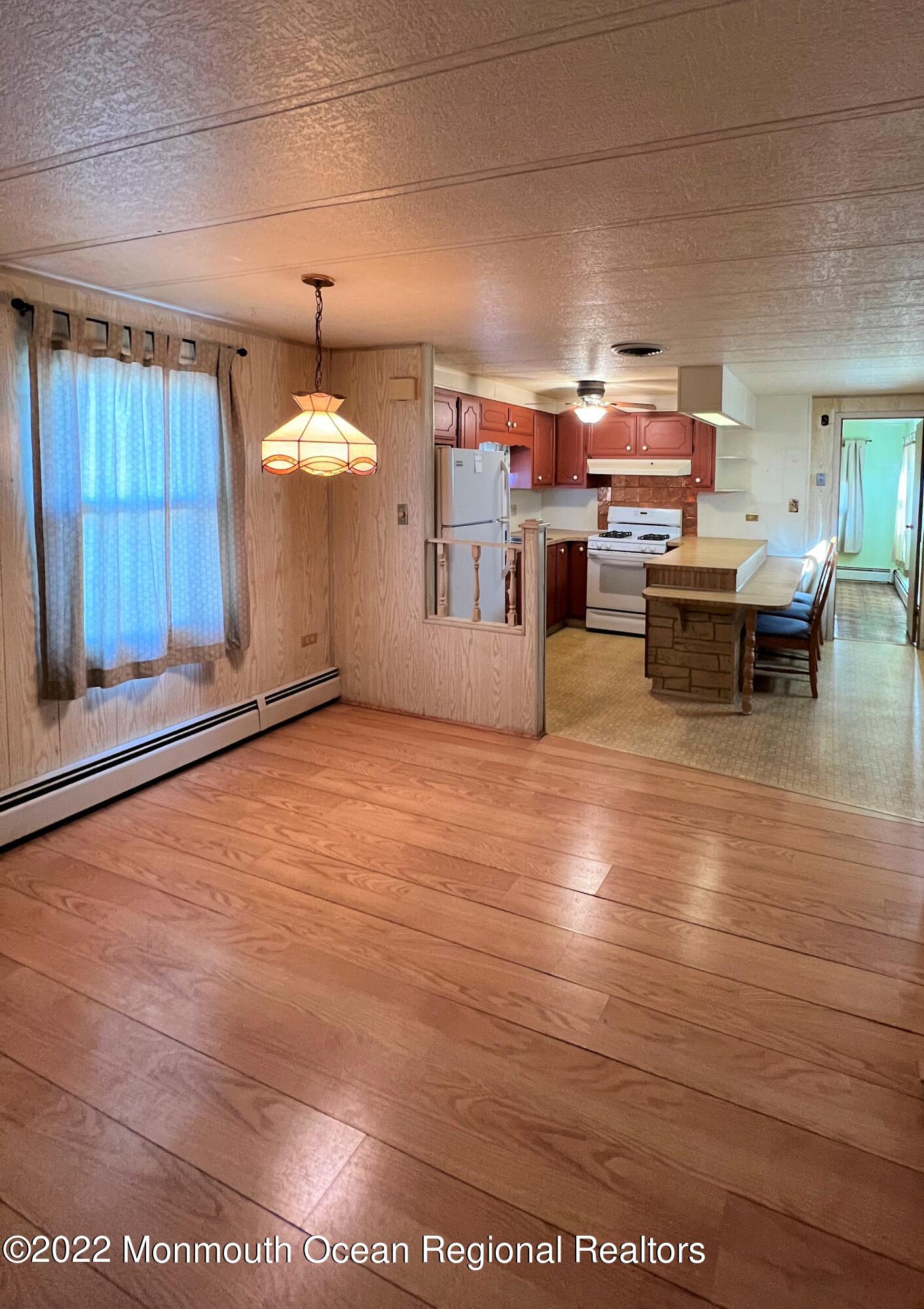 705 Aviary Way Toms River, NJ 08755 - Photo 5 of 14 a living room with furniture and a chandelier