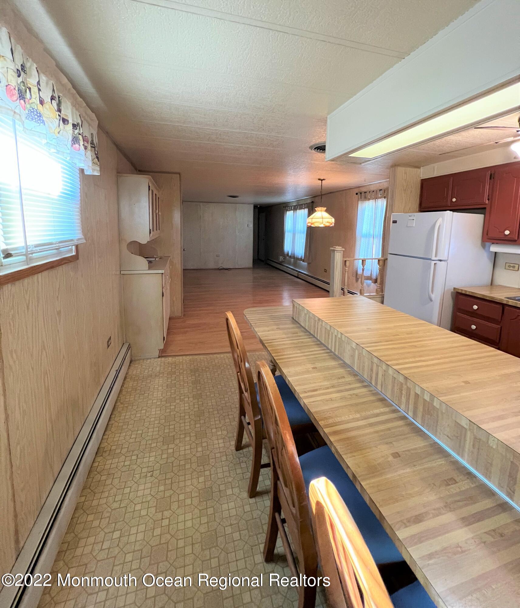 705 Aviary Way Toms River, NJ 08755 - Photo 7 of 14 a bedroom with a bed and a view of kitchen