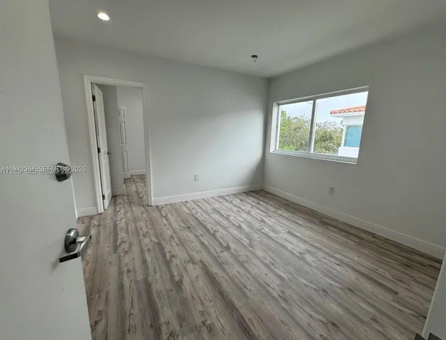 a view of a kitchen with a washer and dryer