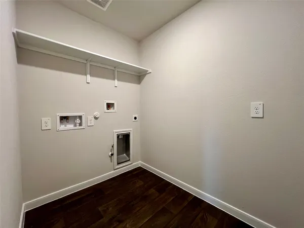 a view of room with wooden floor and fan