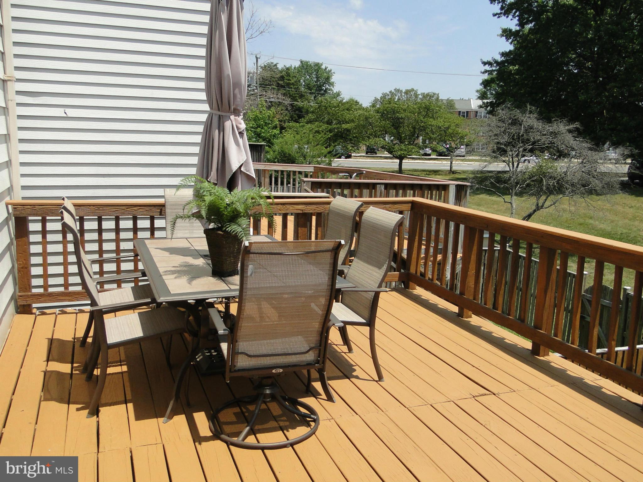 7415 Aspenpark Road Lorton, VA 22079 - Photo 2 of 17 a view of balcony with deck and outdoor seating