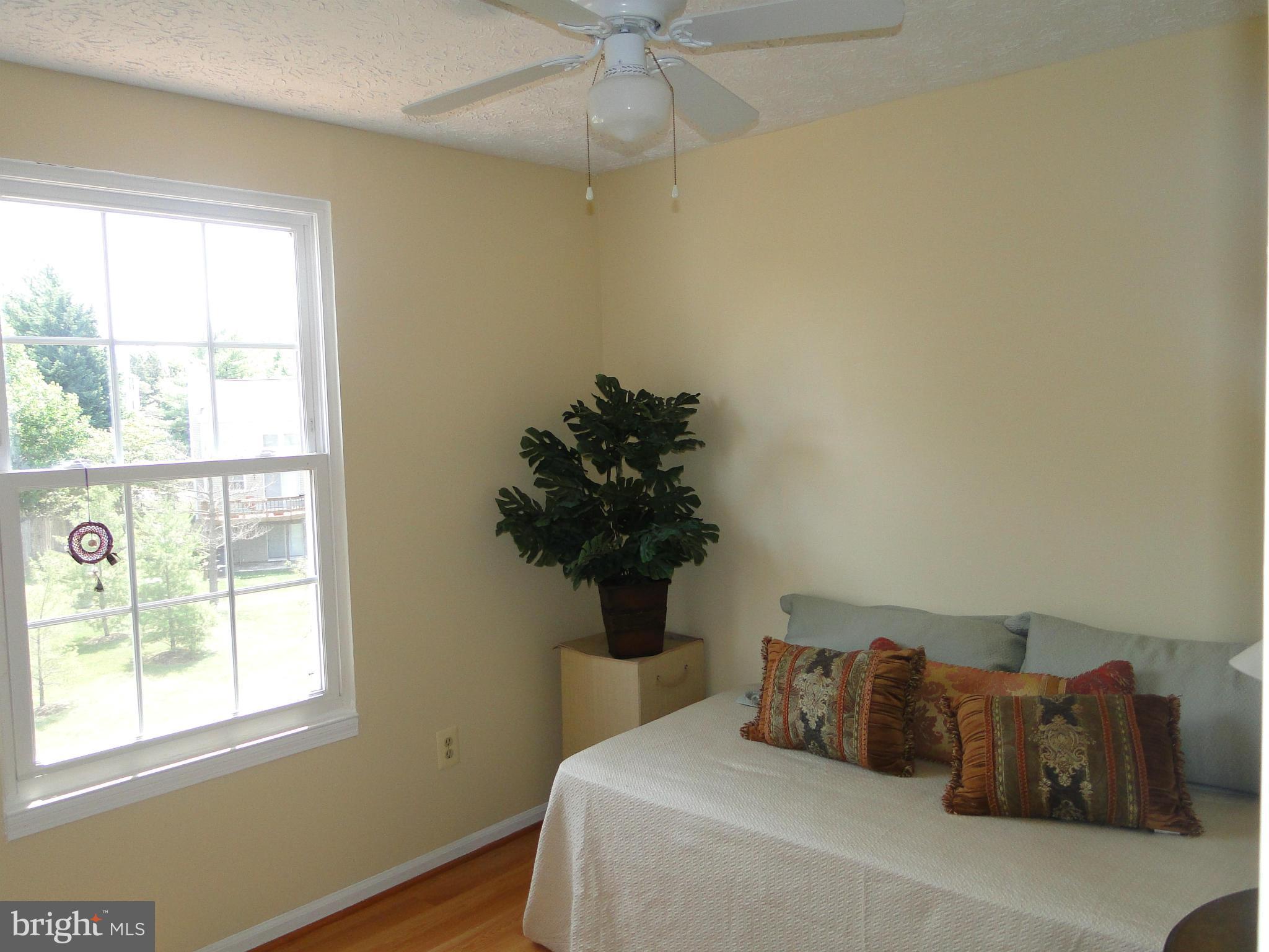 7415 Aspenpark Road Lorton, VA 22079 - Photo 15 of 17 a bedroom with a bed and a window