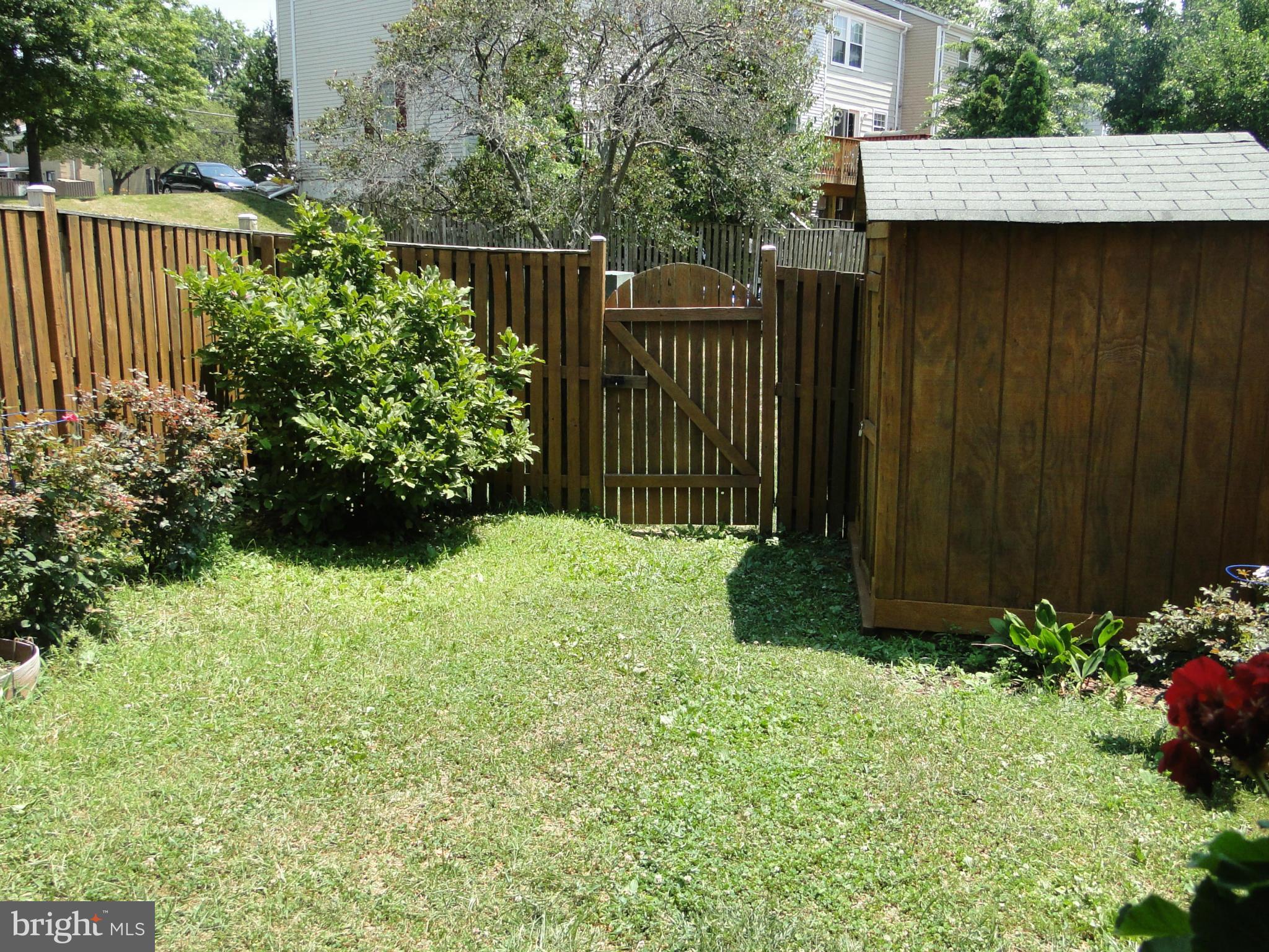 7415 Aspenpark Road Lorton, VA 22079 - Photo 4 of 17 a view of a backyard with pathway