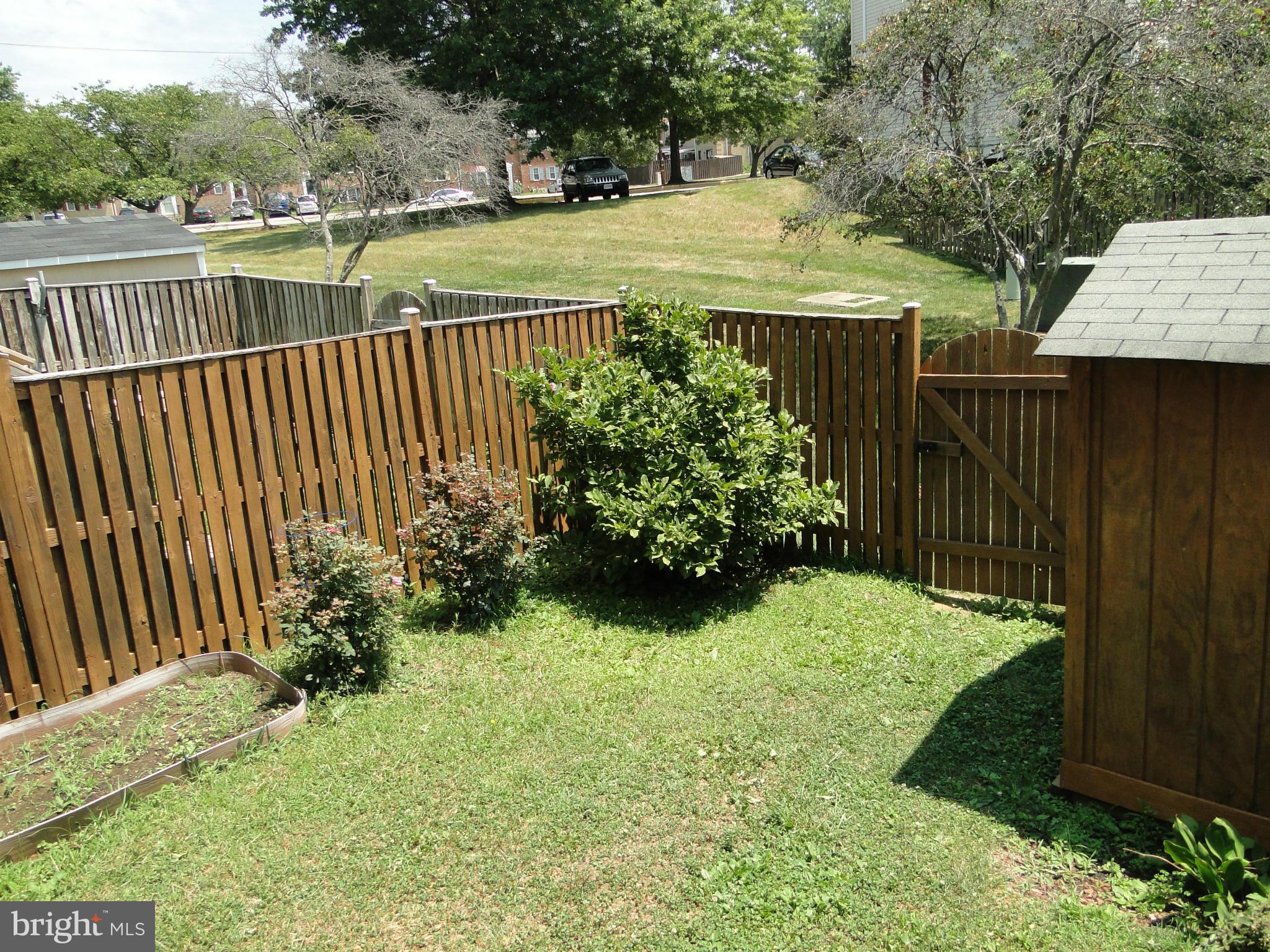 7415 Aspenpark Road Lorton, VA 22079 - Photo 5 of 17 a view of a backyard with pathway