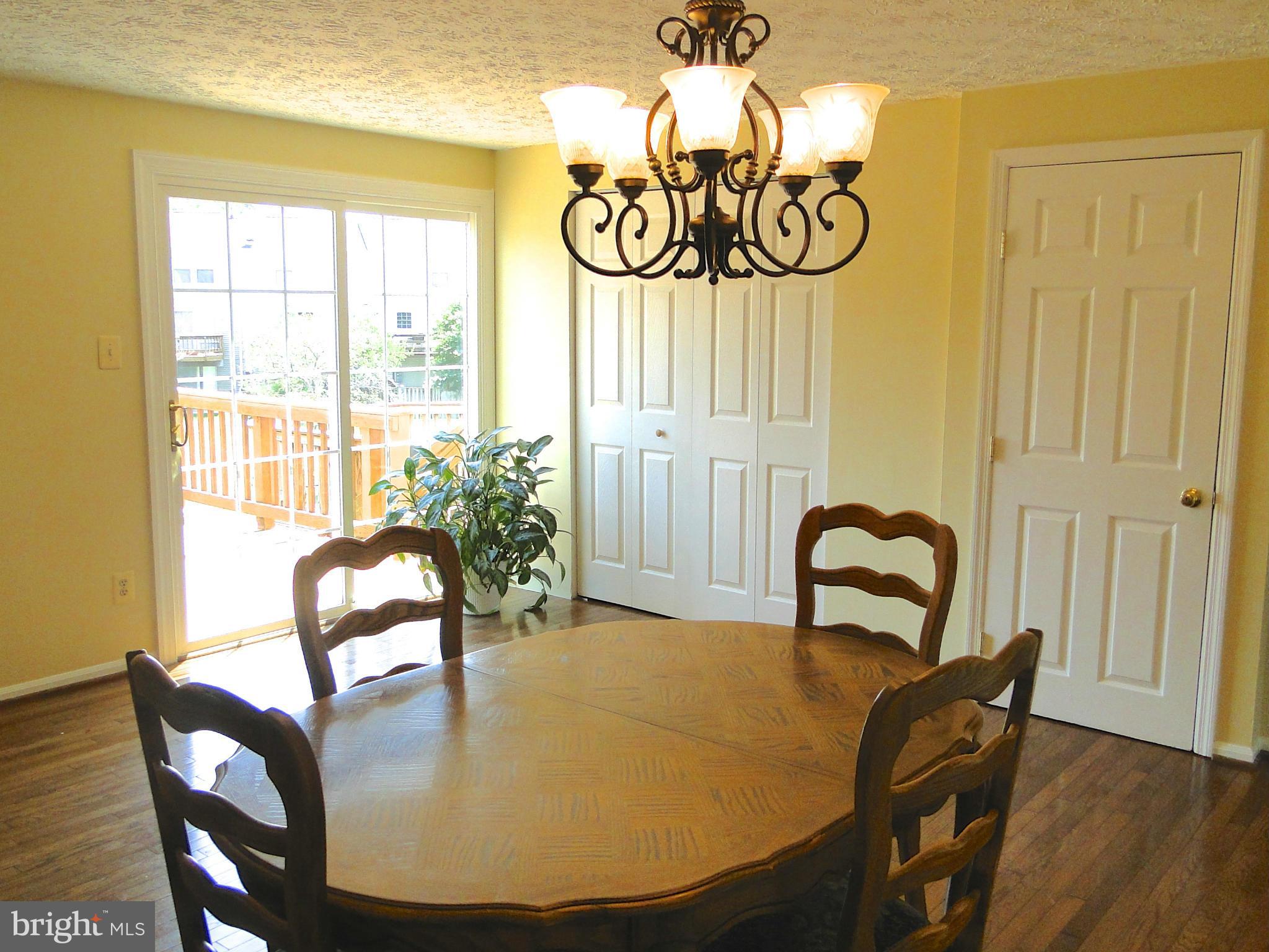 7415 Aspenpark Road Lorton, VA 22079 - Photo 9 of 17 a view of a dining room with furniture window and outside view