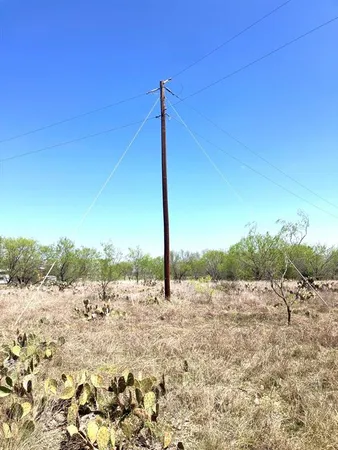 a view of a road with a yard