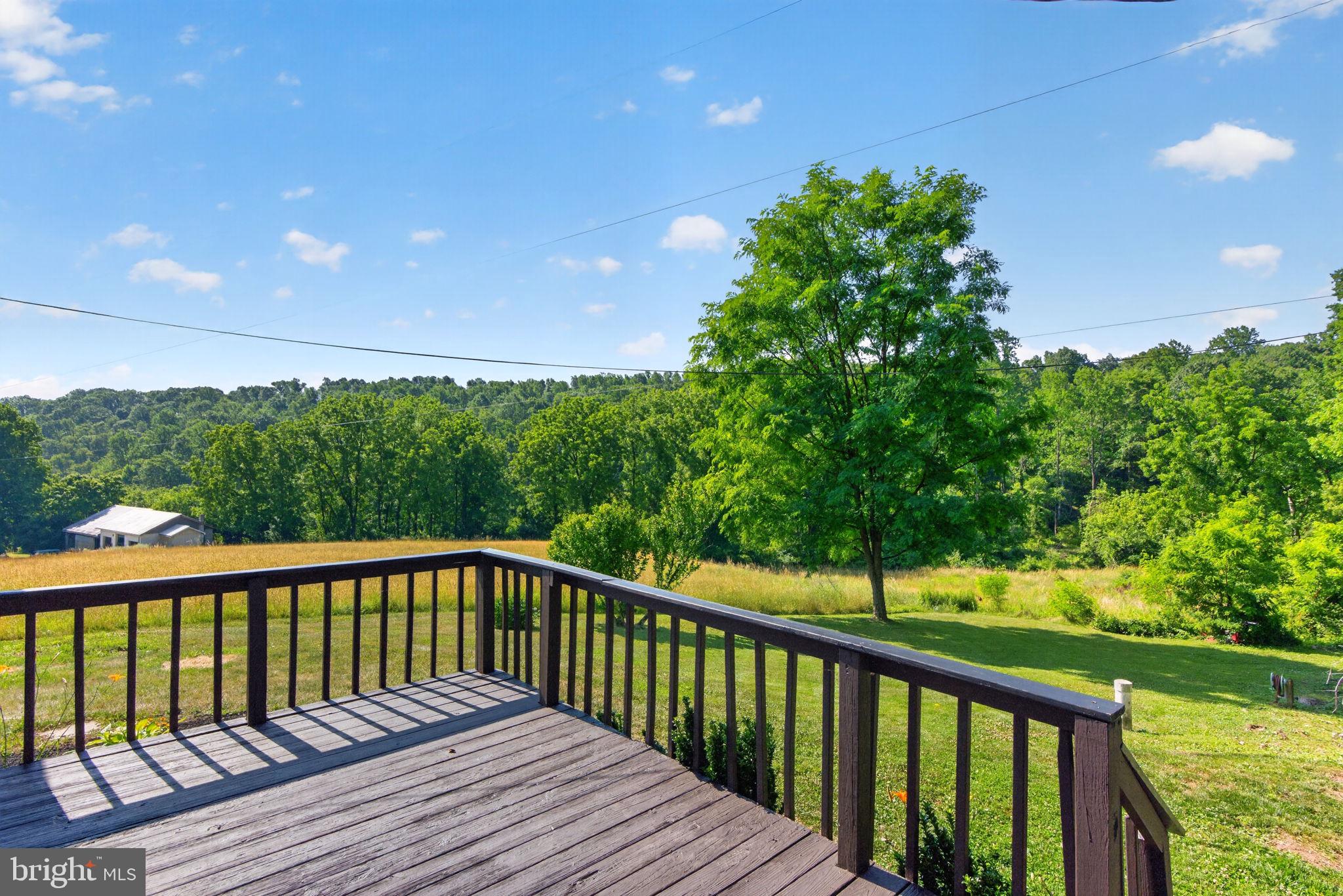 140 Limekiln Road Reading, PA 19606 - Photo 4 of 37 a view of a wooden deck with a yard