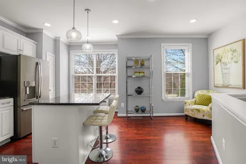 a living room with furniture window and wooden floor