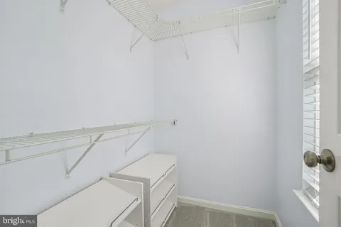 a view of storage and utility room with washer and dryer