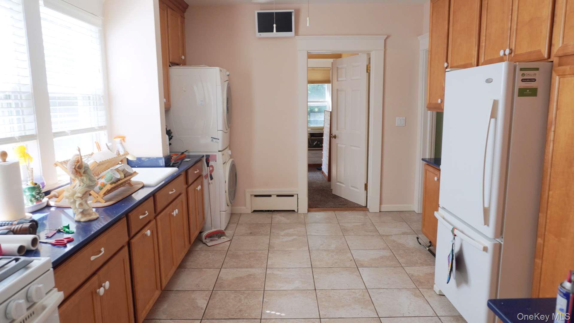 20 Pelhamside Drive New Rochelle, NY 10801 - Photo 7 of 28 a kitchen with stainless steel appliances a refrigerator and a stove