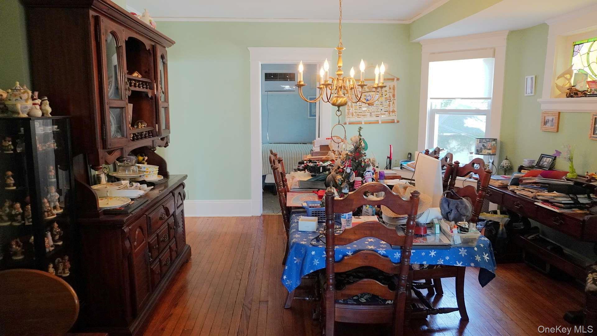 20 Pelhamside Drive New Rochelle, NY 10801 - Photo 9 of 28 a view of a dining room with furniture and chandelier