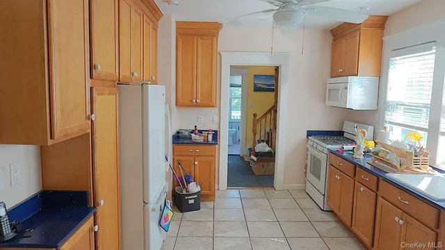 a kitchen with a refrigerator and a stove