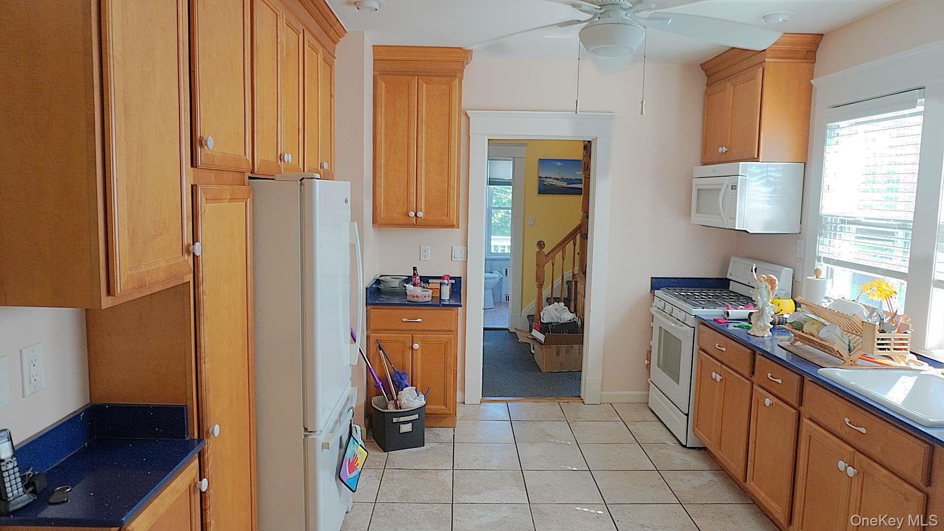 20 Pelhamside Drive New Rochelle, NY 10801 - Photo 10 of 28 a kitchen with a refrigerator and a stove
