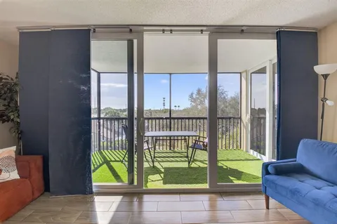 a view of entryway and hall with a couch