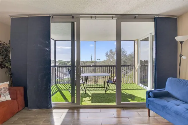 a view of entryway and hall with a couch