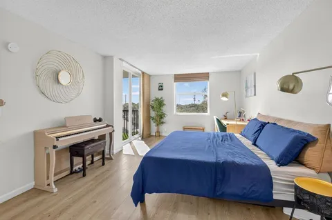 a bed room with a bed and a fish aquarium