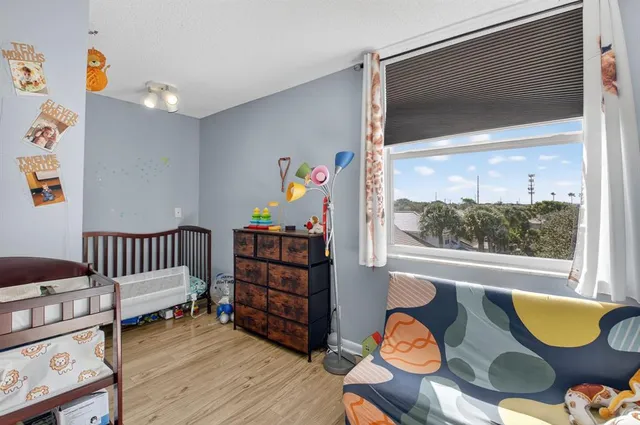 a bedroom with furniture and a window