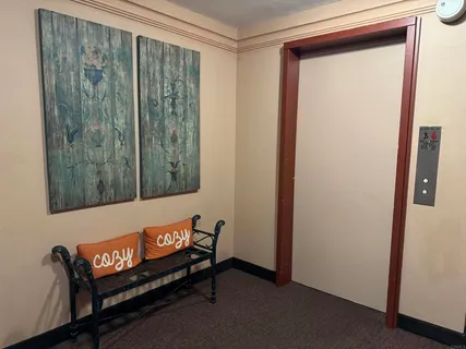 a bench sitting in front of a window