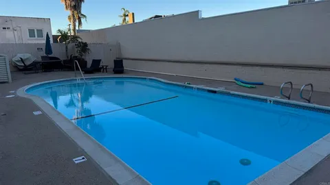 a view of a living room with bathroom