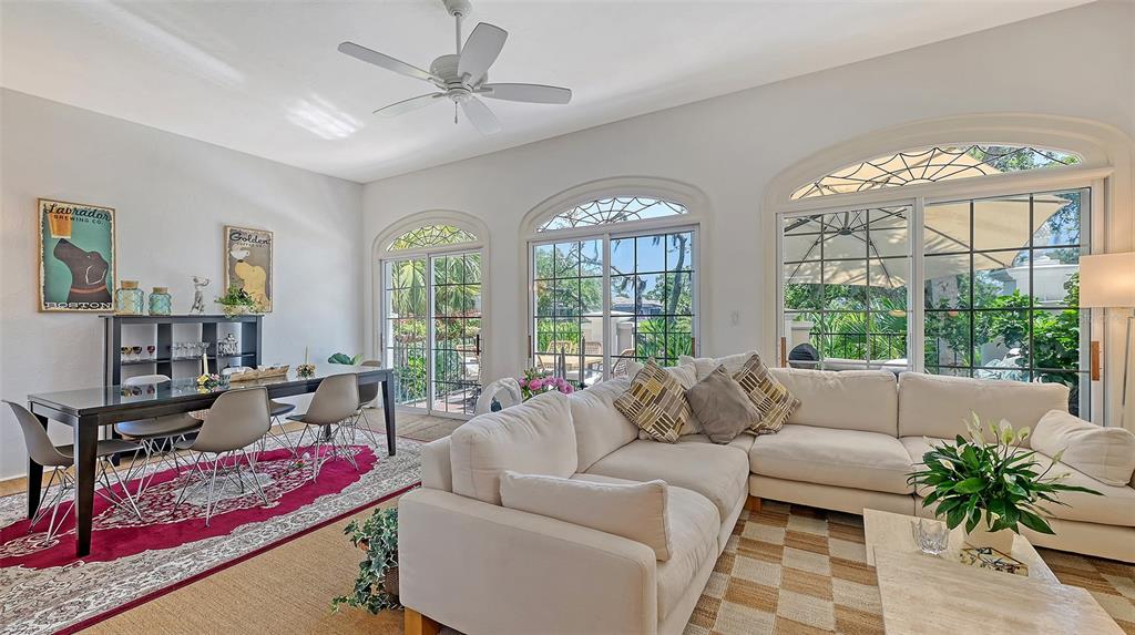 33 Bishopscourt Road, Unit 118 Osprey, FL 34229 - Photo 11 of 80 a living room with furniture and a large window
