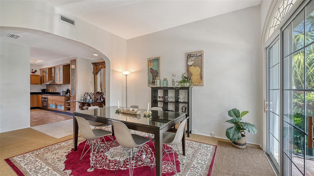 33 Bishopscourt Road, Unit 118 Osprey, FL 34229 - Photo 18 of 80 a living room with furniture and wooden floor